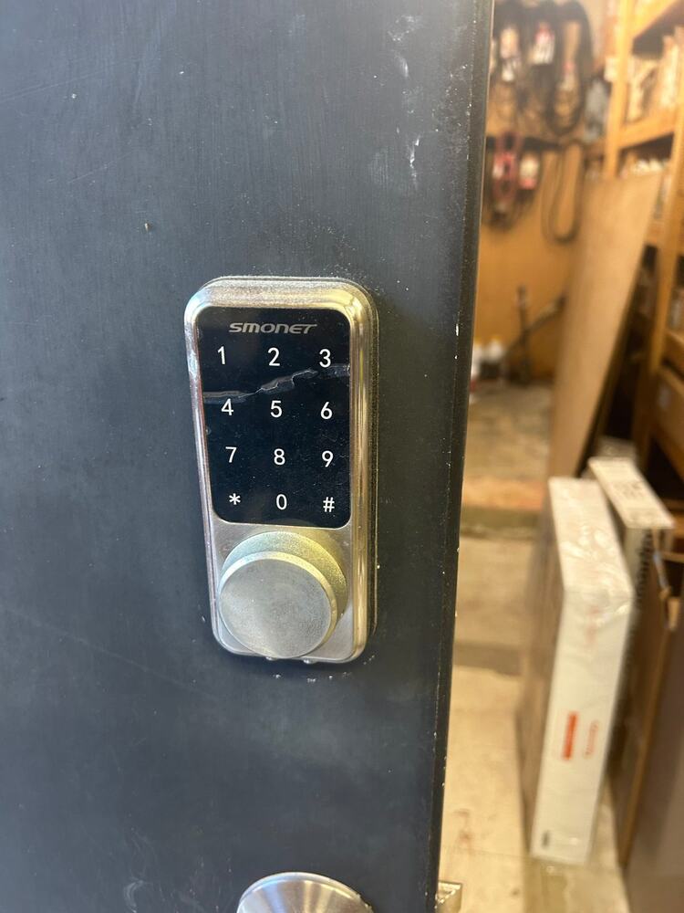 Keypad deadbolt installed on a shop door