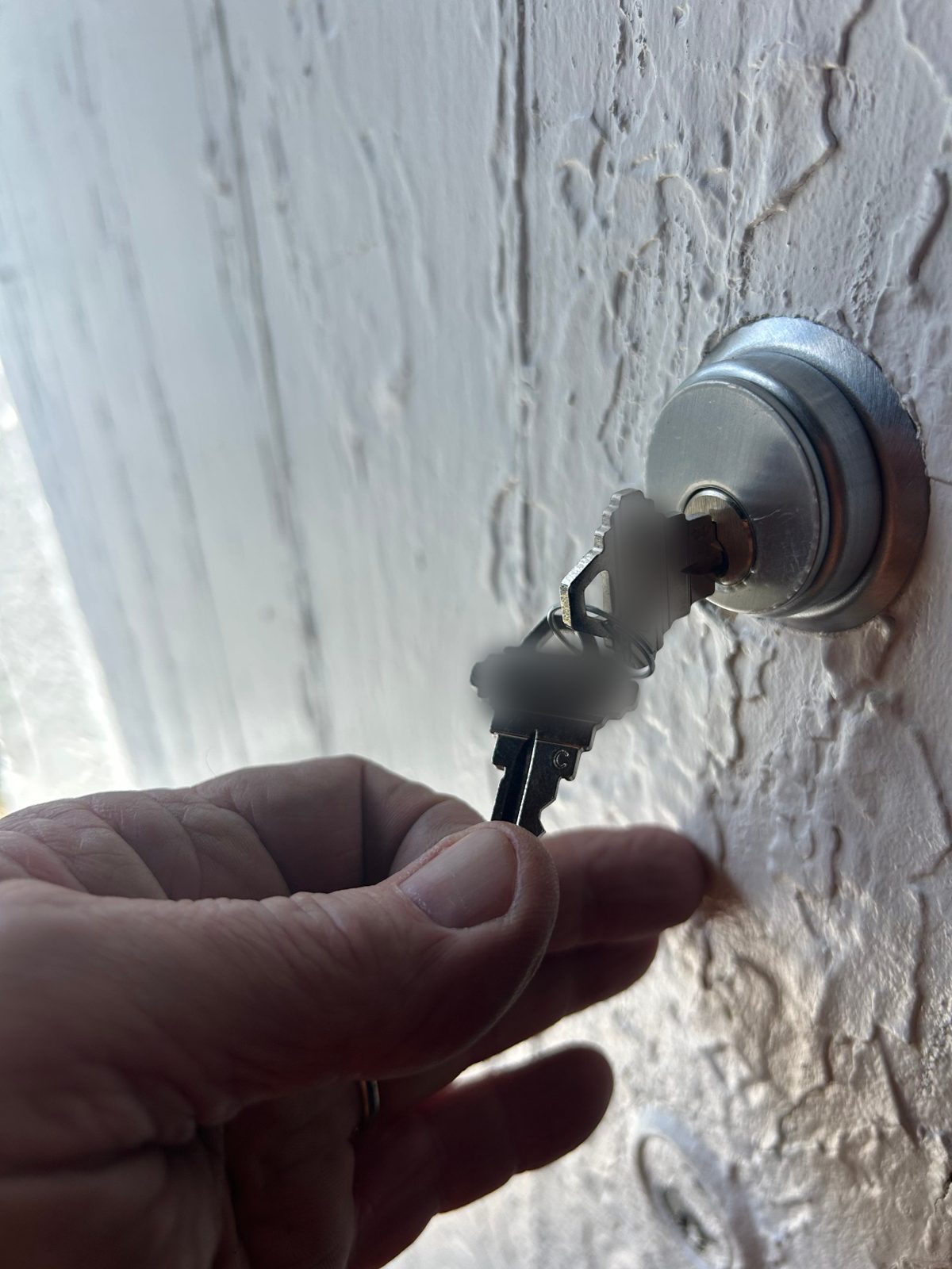 Brian turning a new key in a rim cylinder lock